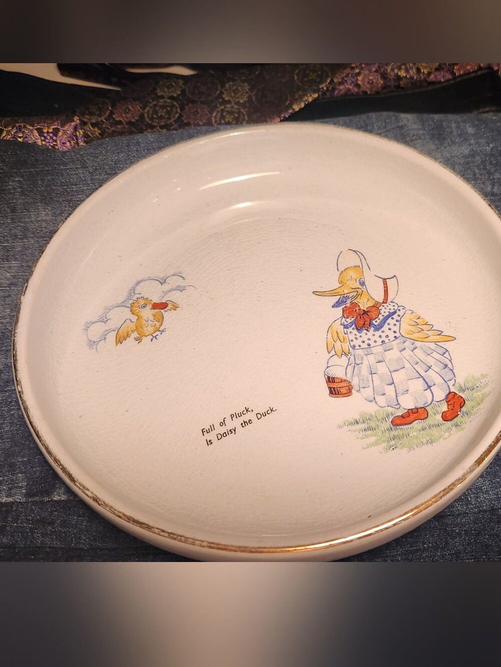 Vintage stoneware children's plate featuring a "Daisy the Duck"
